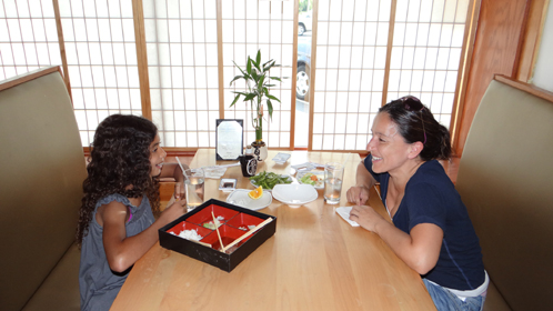 2 happy customers inside Tokyo Sushi III in West Hartford