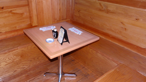 Seating options at Tokyo Sushi III include polished wood benches